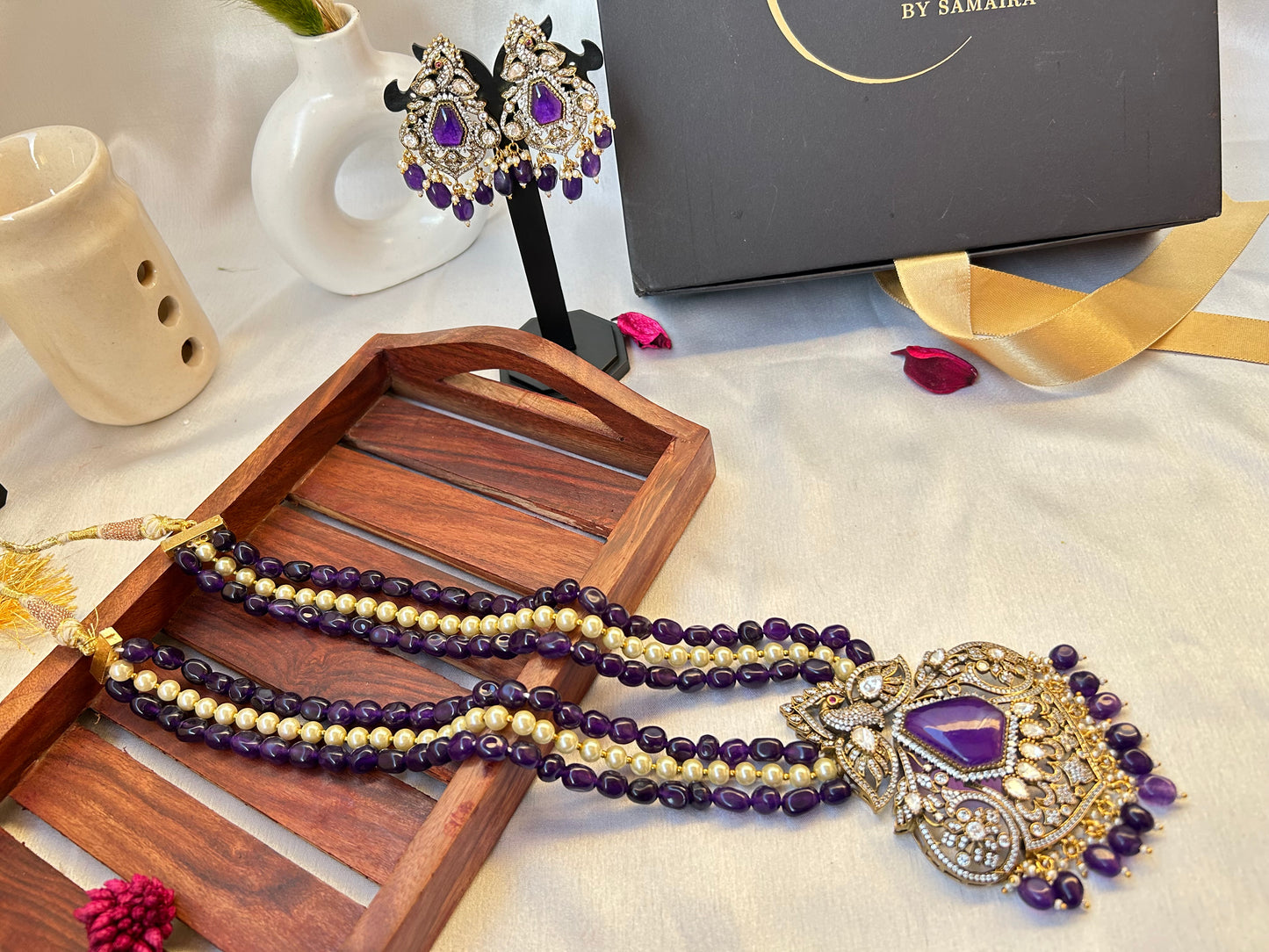 Elegant Kiara Kundan Necklace Set with purple and gold beads, featuring intricate stonework and matching earrings.