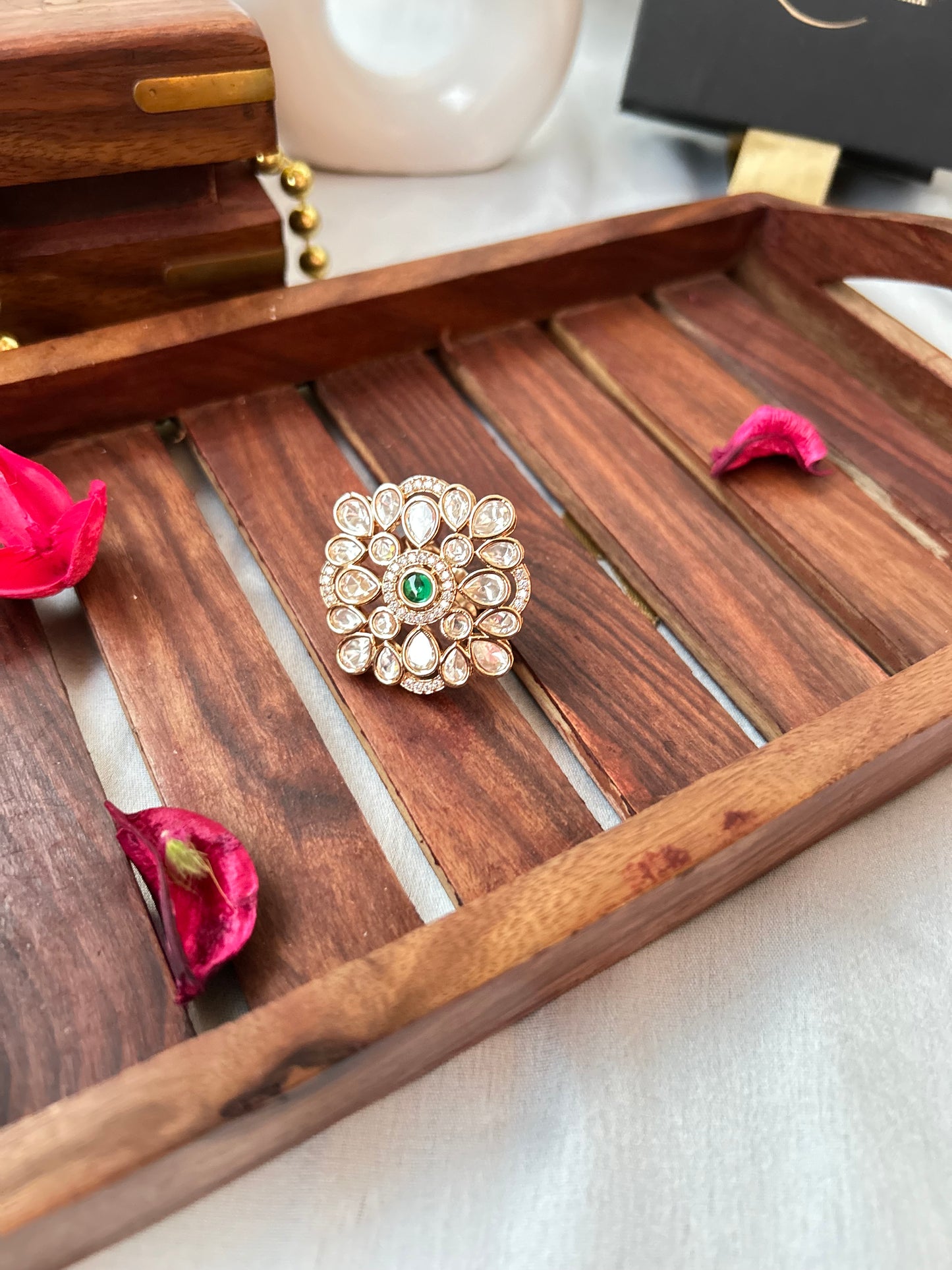 Emerald green and Kundan ring with gold-plated floral design