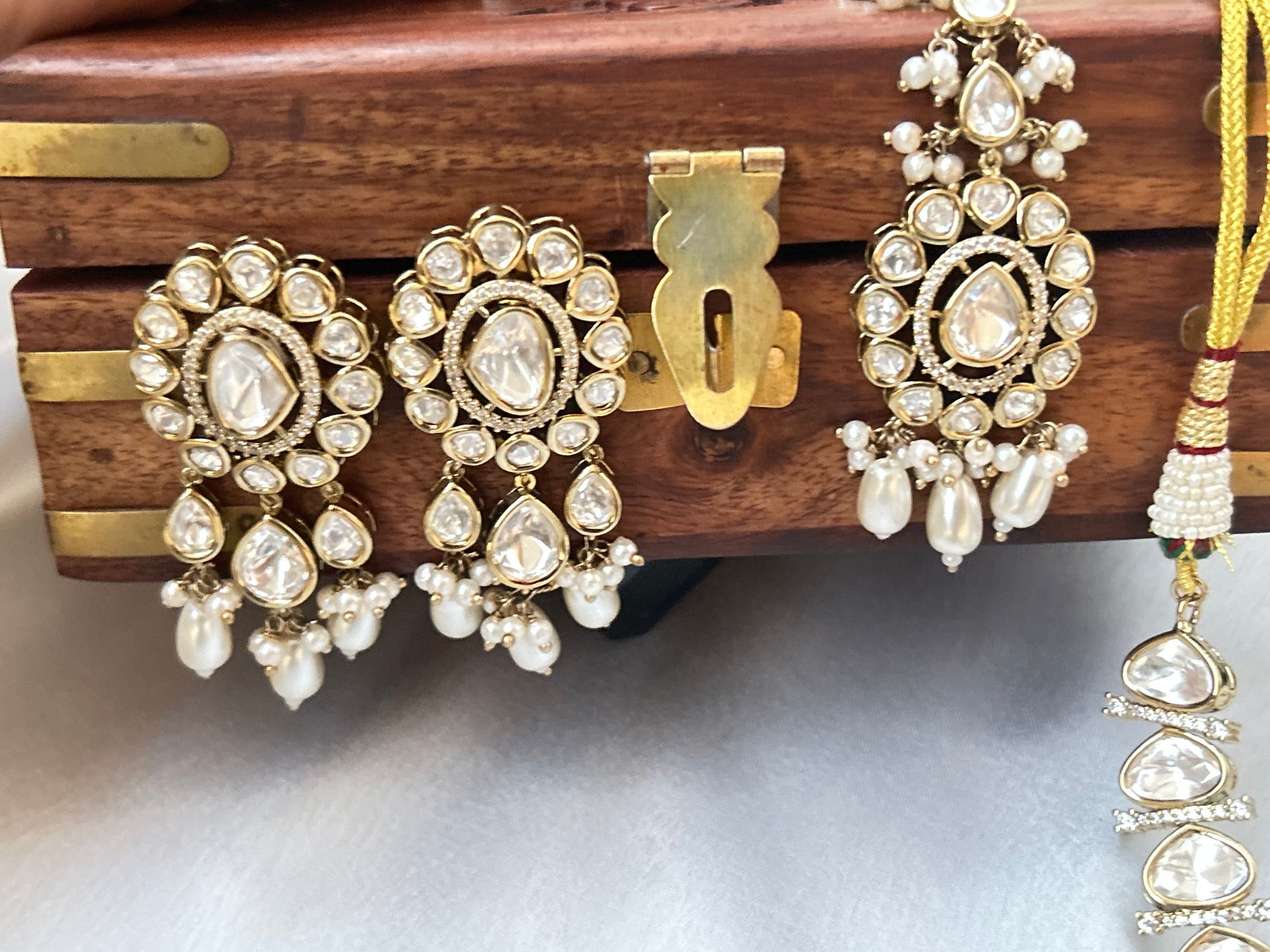 Tashi Kundan Rani Haar (long necklace set with tika )with ivory pearl drops, a regal choice for bridal and festive occasions."