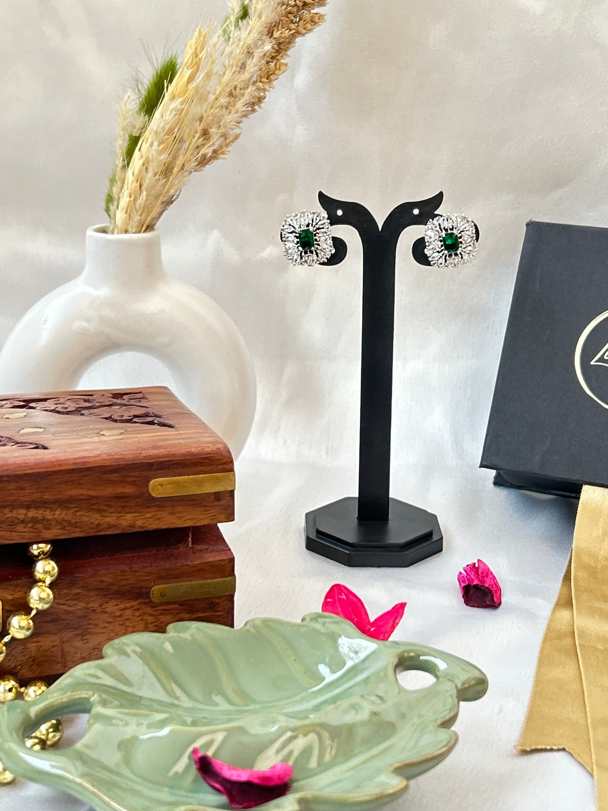 Emerald green stud earrings with American diamonds in a silver-plated setting