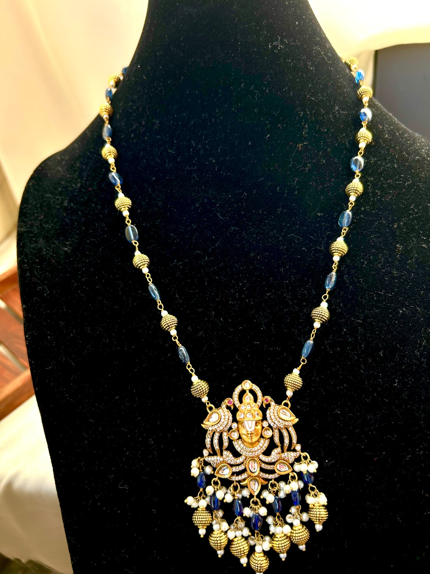 Keshavi Kundan necklace set with navy blue beads and pearls, perfect for weddings and festive wear."