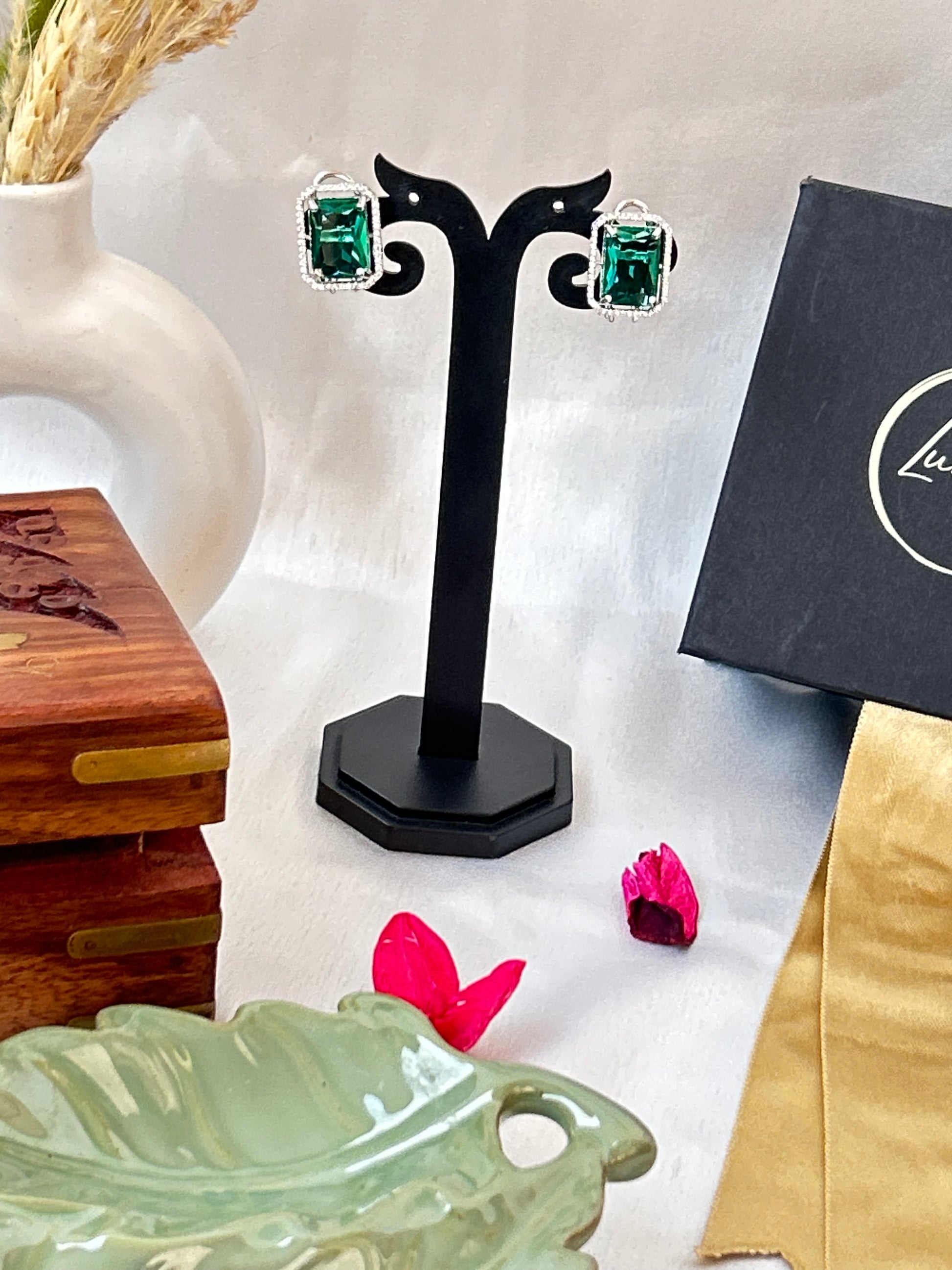 sea green stud earrings with an American diamond halo in a silver-plated setting
