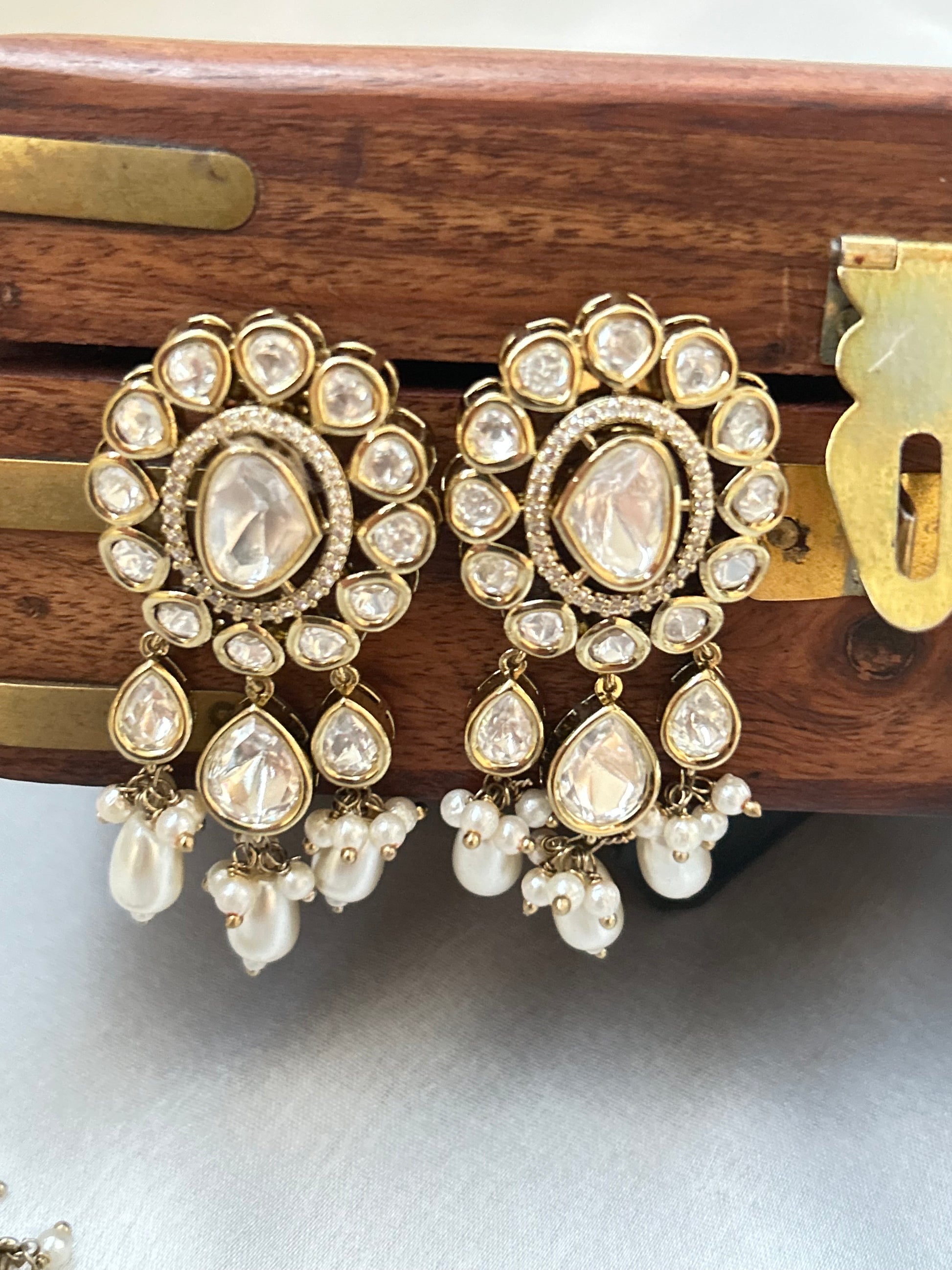 Tashi Kundan Rani Haar (long necklace set with tika )with ivory pearl drops, a regal choice for bridal and festive occasions."