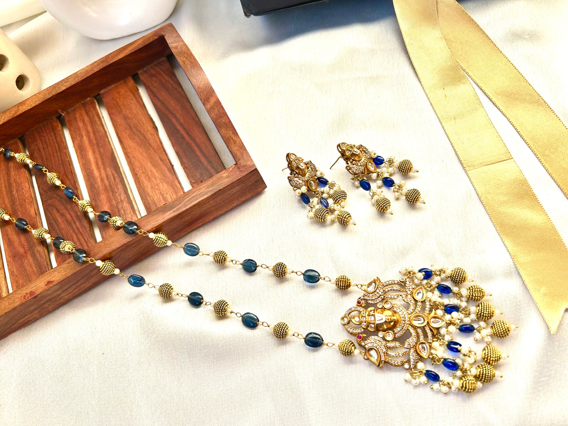 Keshavi Kundan necklace set with navy blue beads and pearls, perfect for weddings and festive wear."