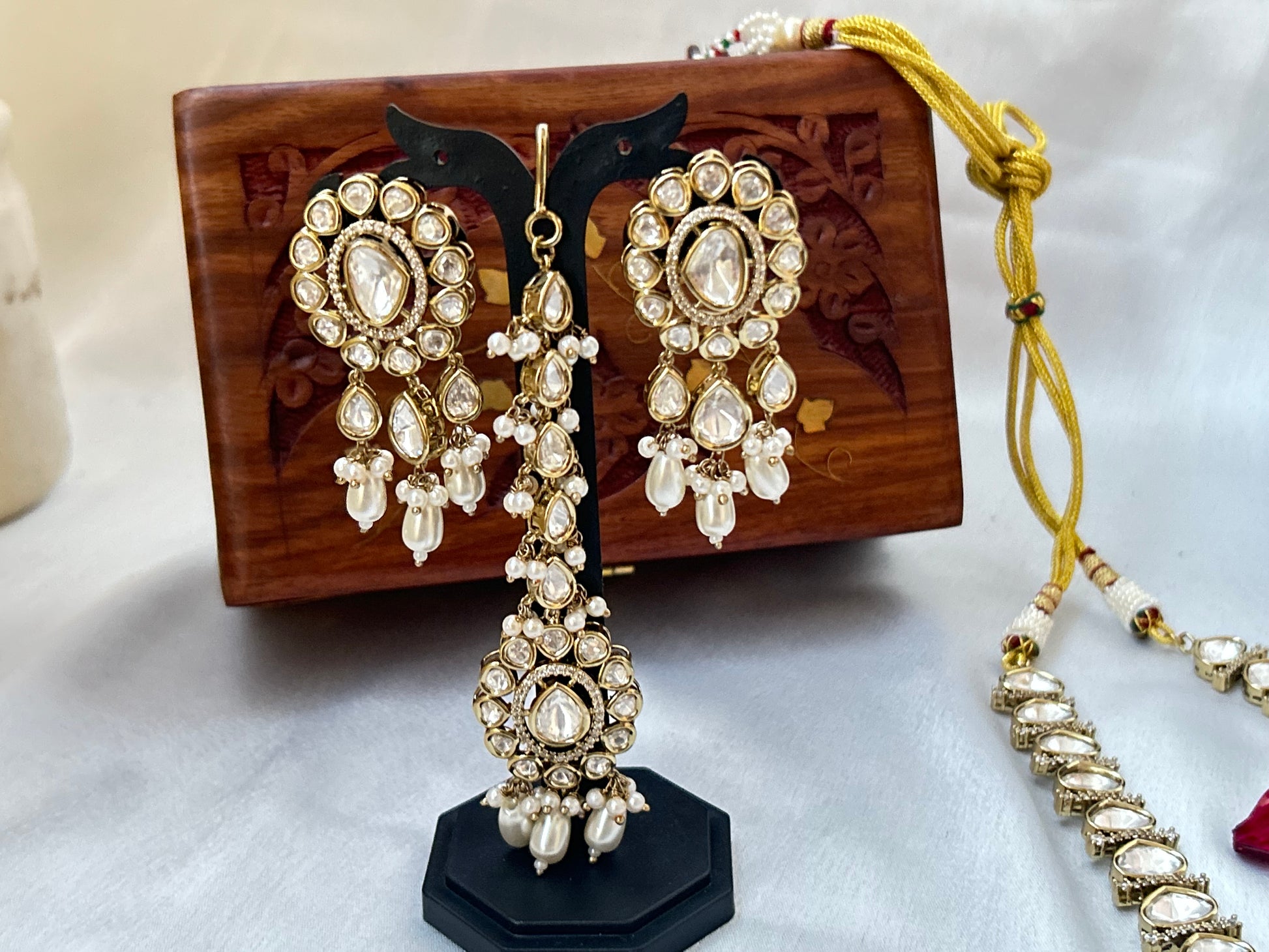 Tashi Kundan Rani Haar (long necklace set with tika )with ivory pearl drops, a regal choice for bridal and festive occasions."