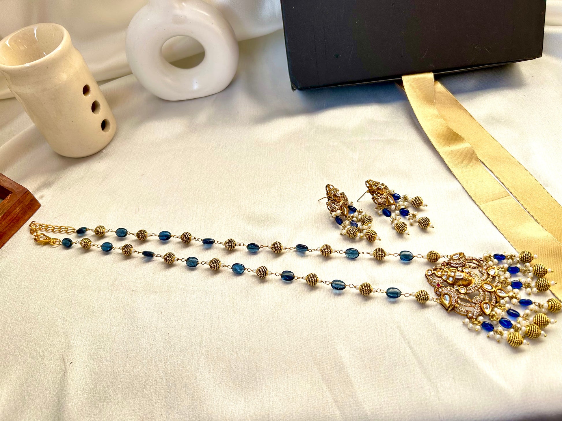 Keshavi Kundan necklace set with navy blue beads and pearls, perfect for weddings and festive wear."
