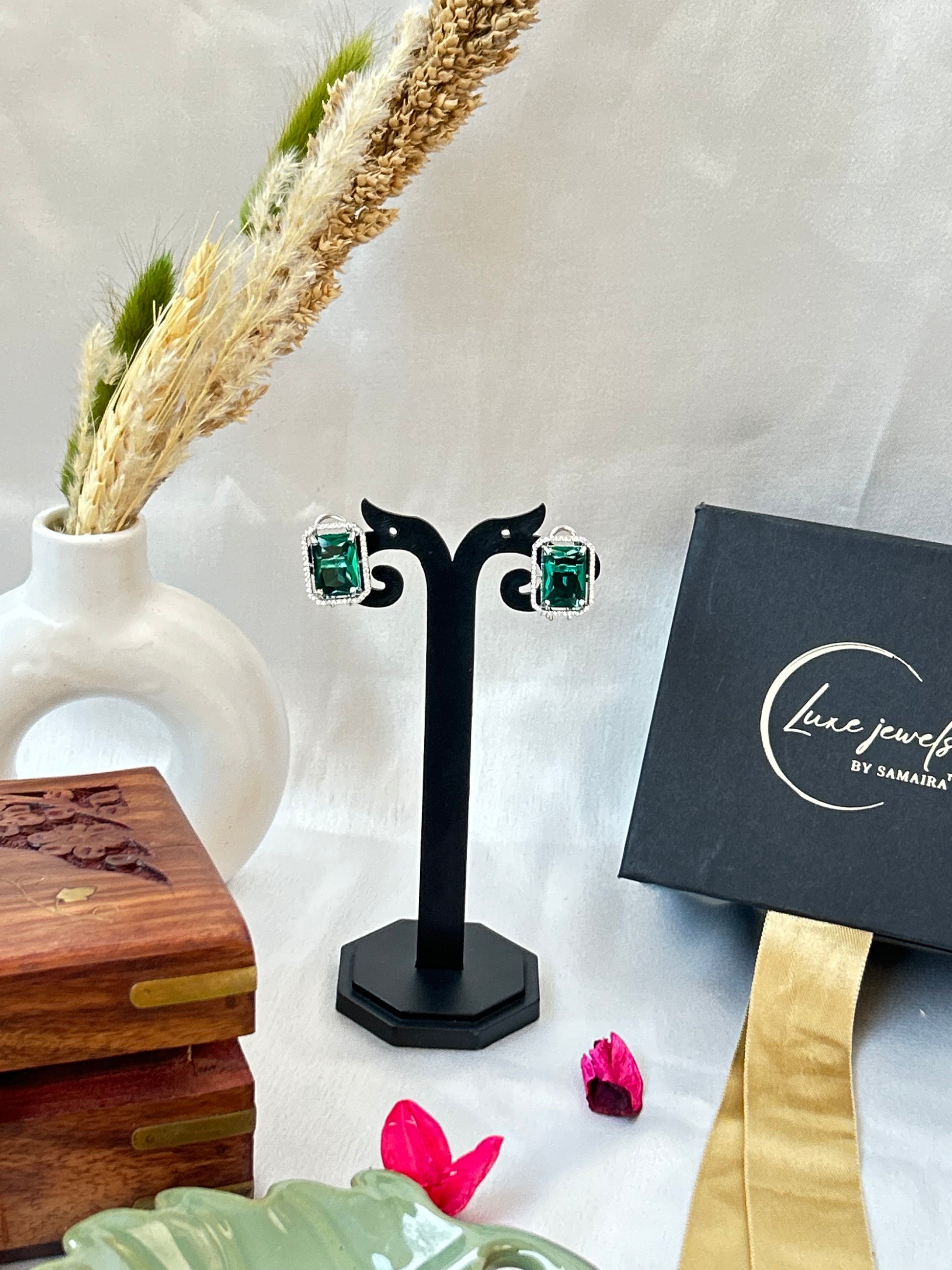 sea green stud earrings with an American diamond halo in a silver-plated setting
