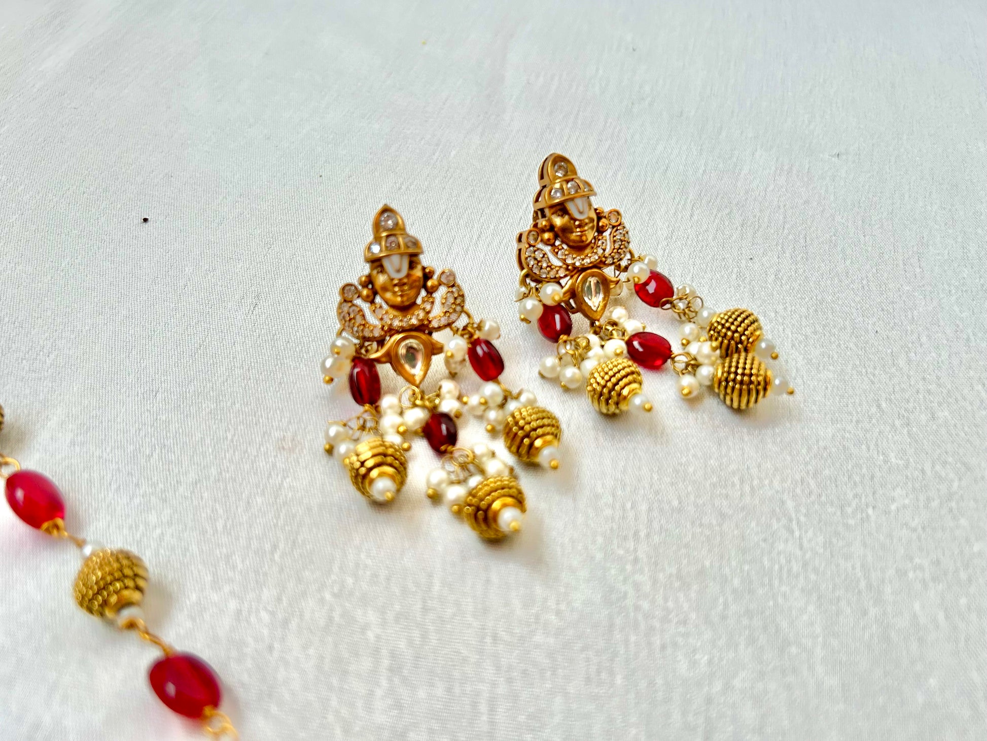 Keshavi Kundan necklace set with red beads and pearls, perfect for weddings and festive wear."