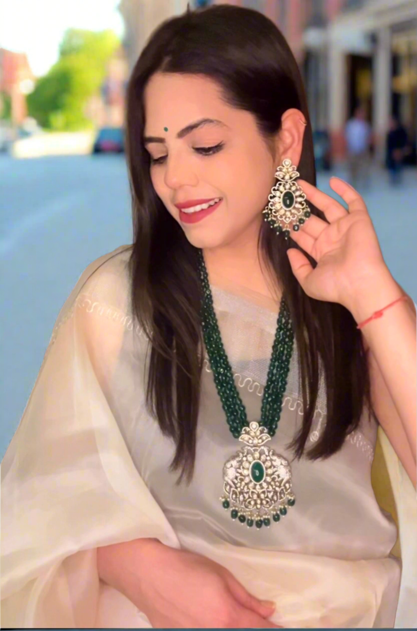 Simar Emerald Kundan Necklace Set with lush green beads, uncut Kundan stones, and matching earrings, perfect for bridal and festive wear.