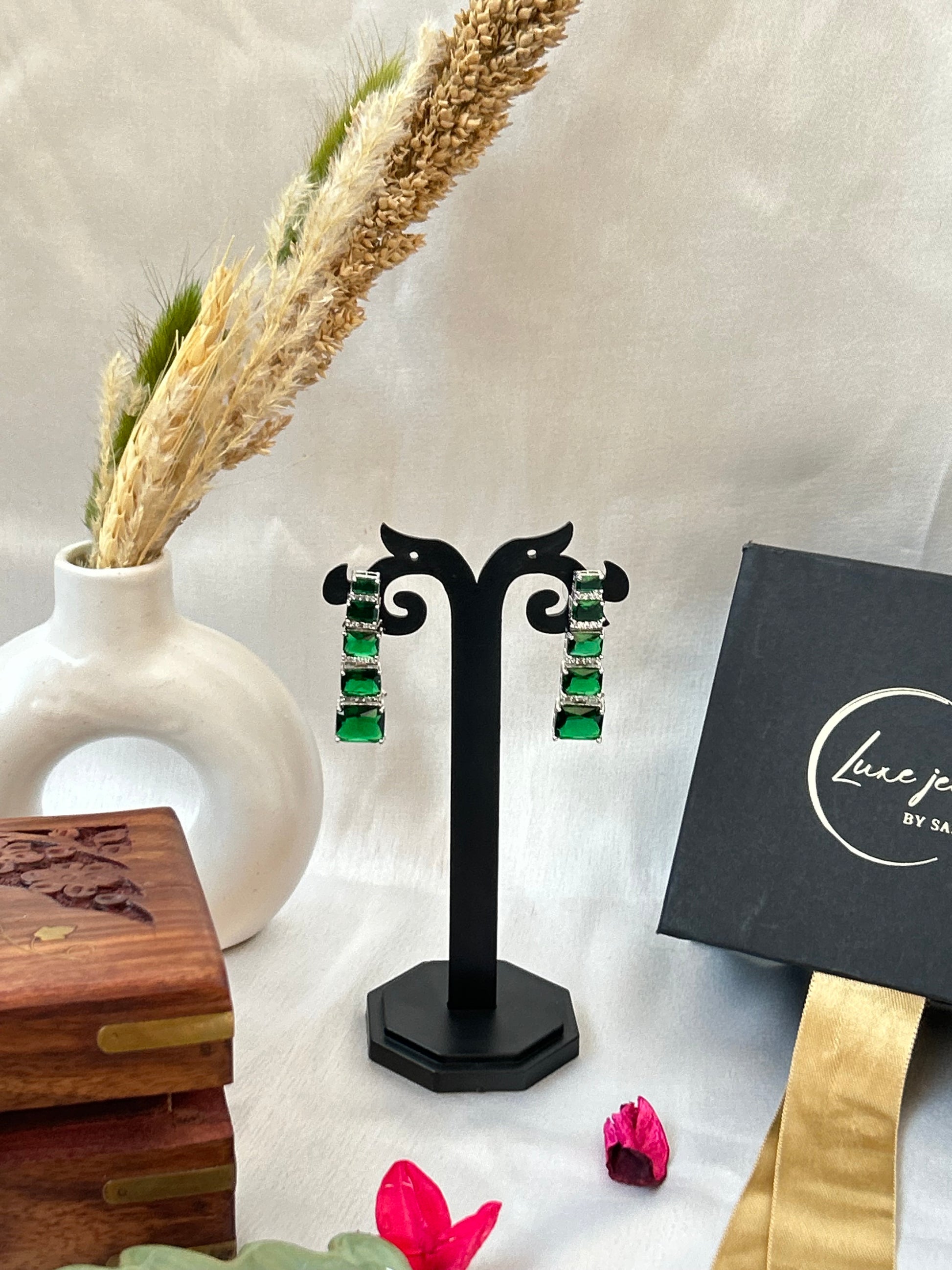 Luxurious emerald-green long earrings with American diamonds
