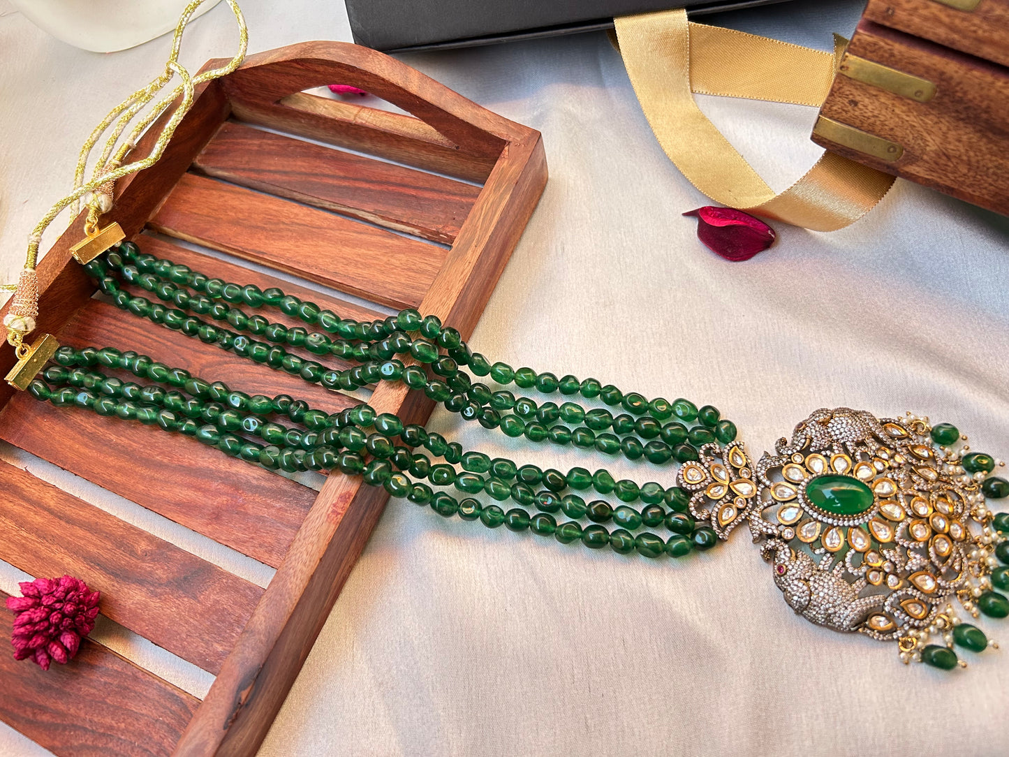 Simar Emerald Kundan Necklace Set with lush green beads, uncut Kundan stones, and matching earrings, perfect for bridal and festive wear.emerald green rani haar long necklace