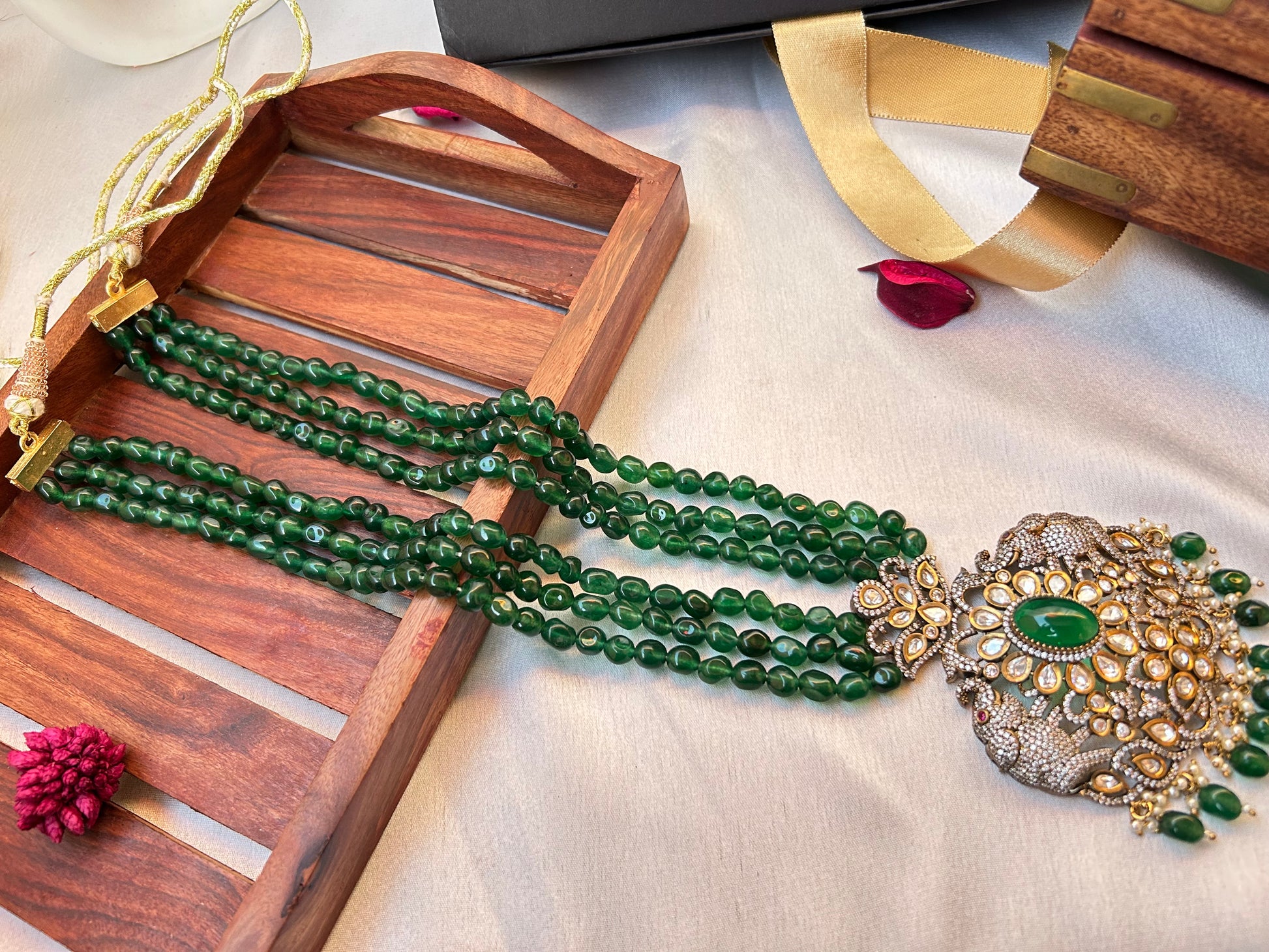 Simar Emerald Kundan Necklace Set with lush green beads, uncut Kundan stones, and matching earrings, perfect for bridal and festive wear.emerald green rani haar long necklace