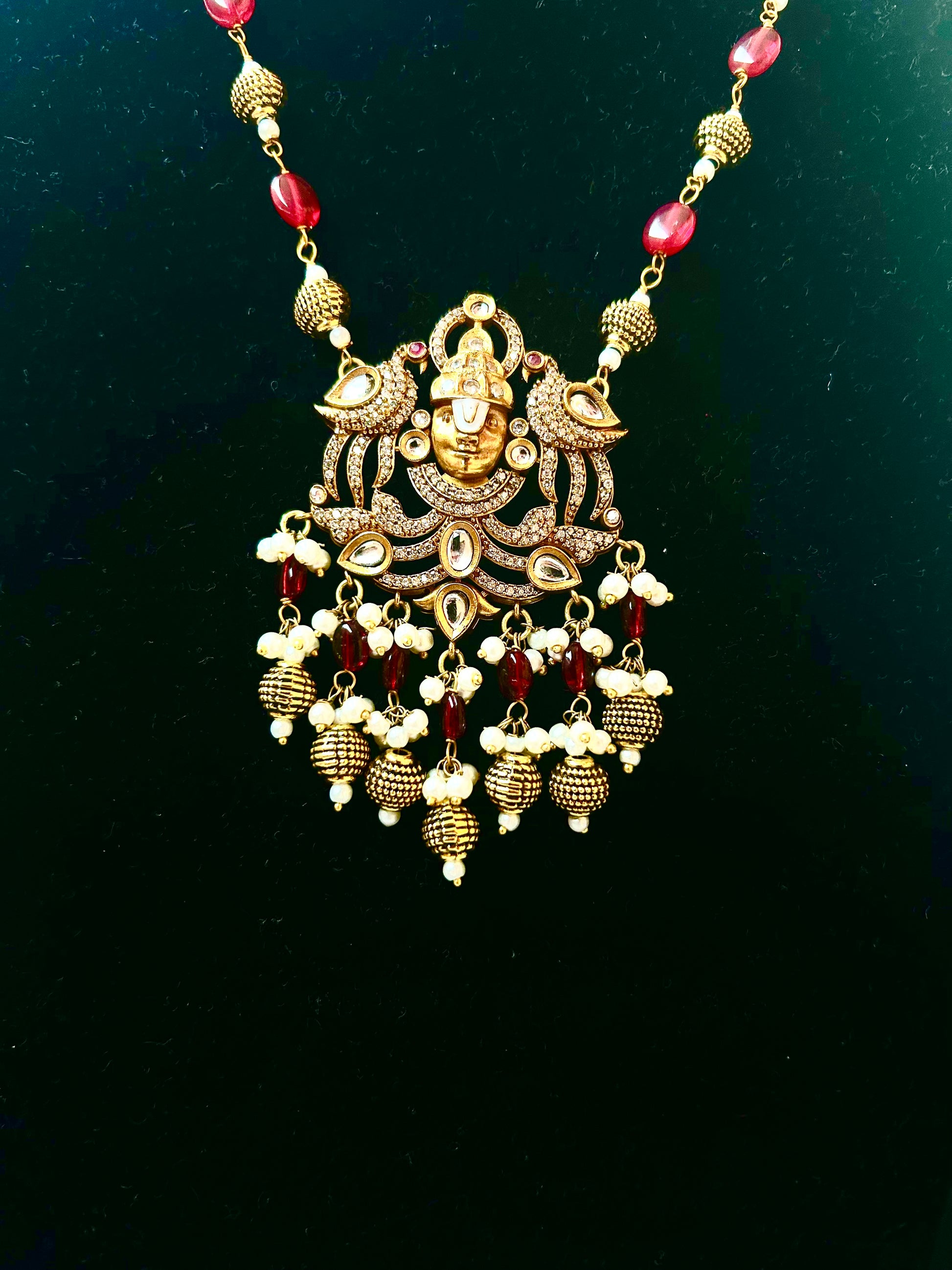 Keshavi Kundan necklace set with red beads and pearls, perfect for weddings and festive wear."