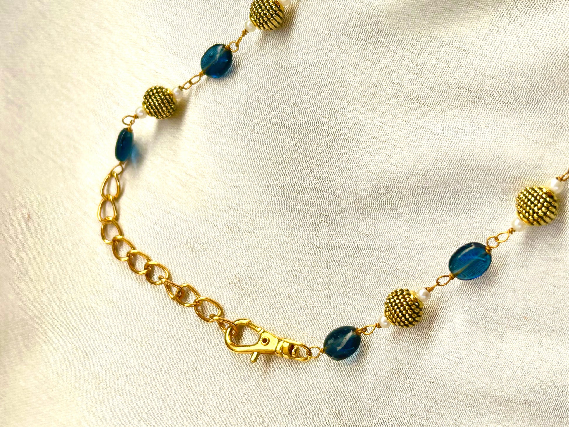 Keshavi Kundan necklace set with navy blue beads and pearls, perfect for weddings and festive wear."
