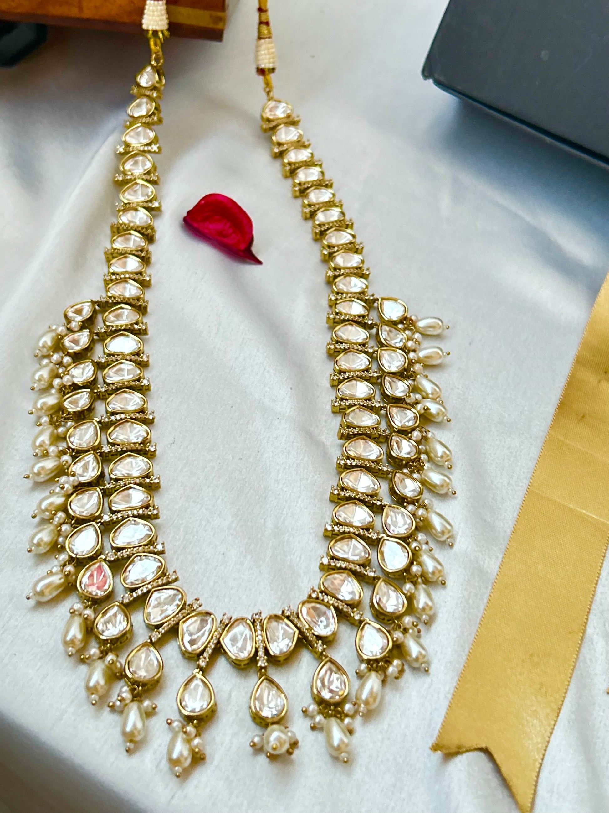 Tashi Kundan Rani Haar (long necklace set with tika )with ivory pearl drops, a regal choice for bridal and festive occasions."