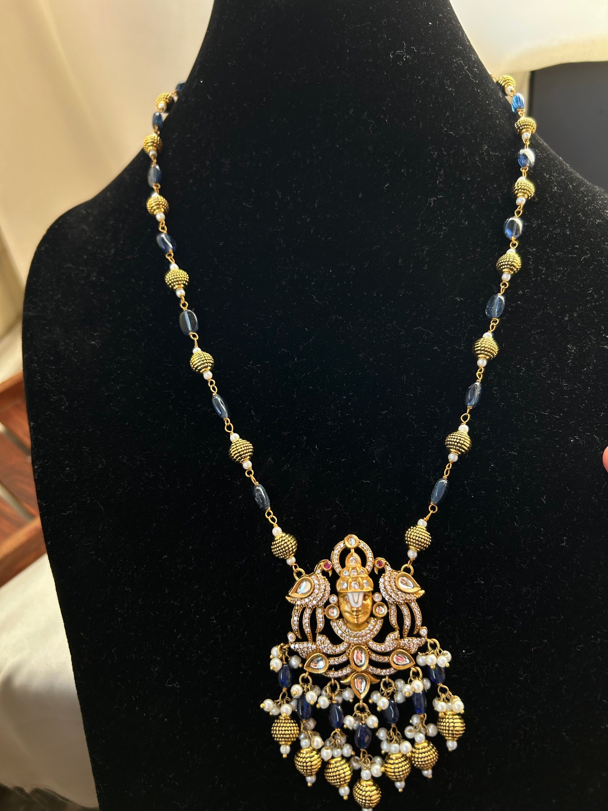 Keshavi Kundan necklace set with navy blue beads and pearls, perfect for weddings and festive wear."