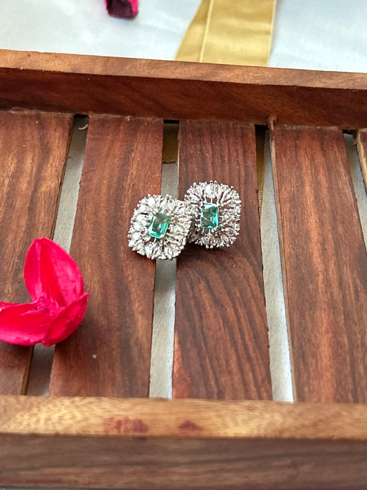 Sea green stud earrings with American diamond halo and silver-plated finish