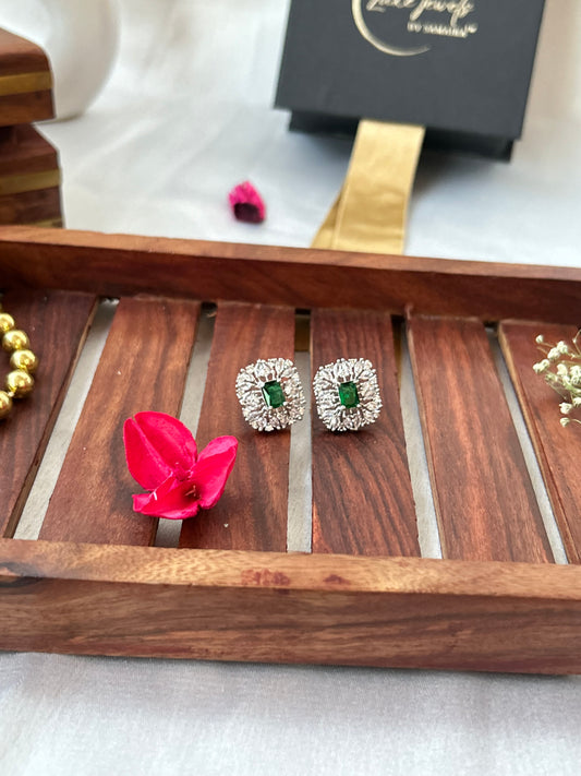 Emerald green stud earrings with American diamonds in a silver-plated setting