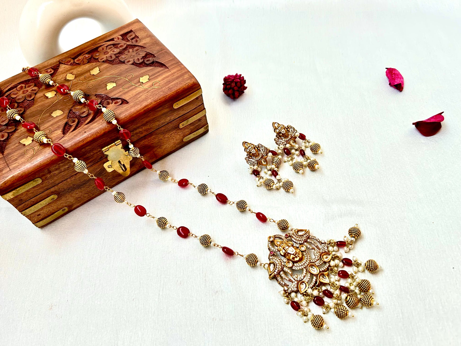 Keshavi Kundan necklace set with red beads and pearls, perfect for weddings and festive wear."