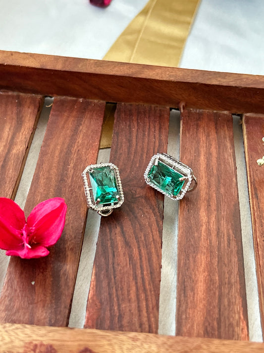 sea green stud earrings with an American diamond halo in a silver-plated setting