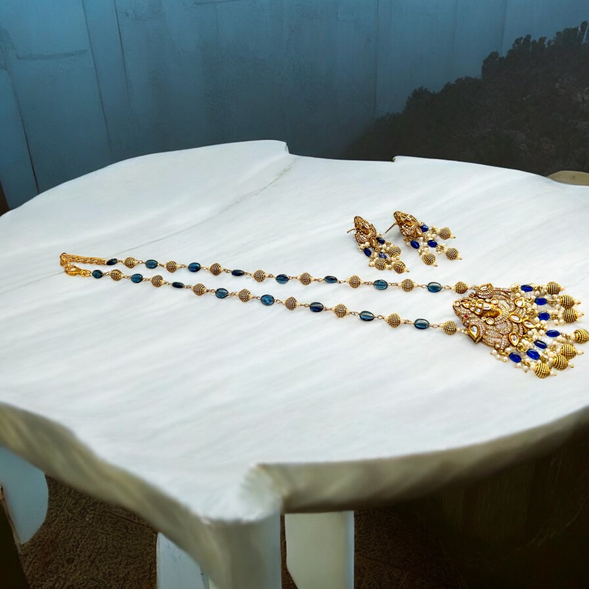 Keshavi Kundan necklace set with navy blue beads and pearls, perfect for weddings and festive wear."