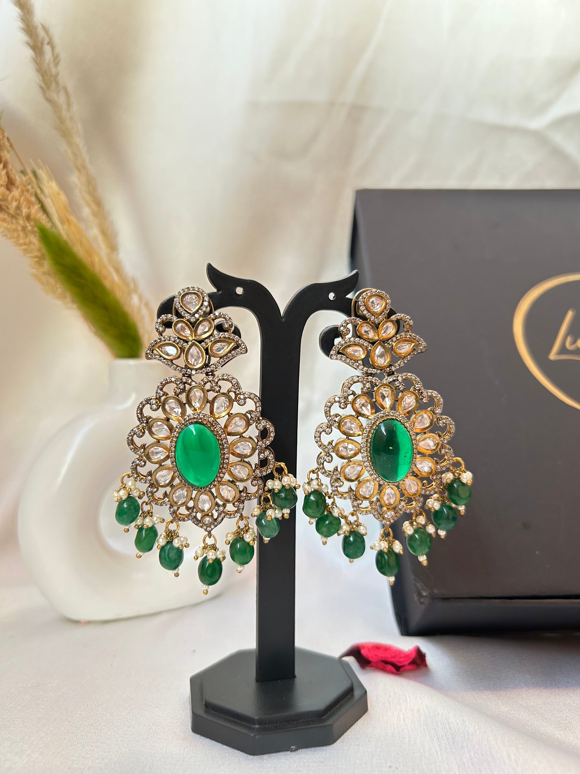 Simar Emerald Kundan Necklace Set with lush green beads, uncut Kundan stones, and matching earrings, perfect for bridal and festive wear.emerald green rani haar long necklace