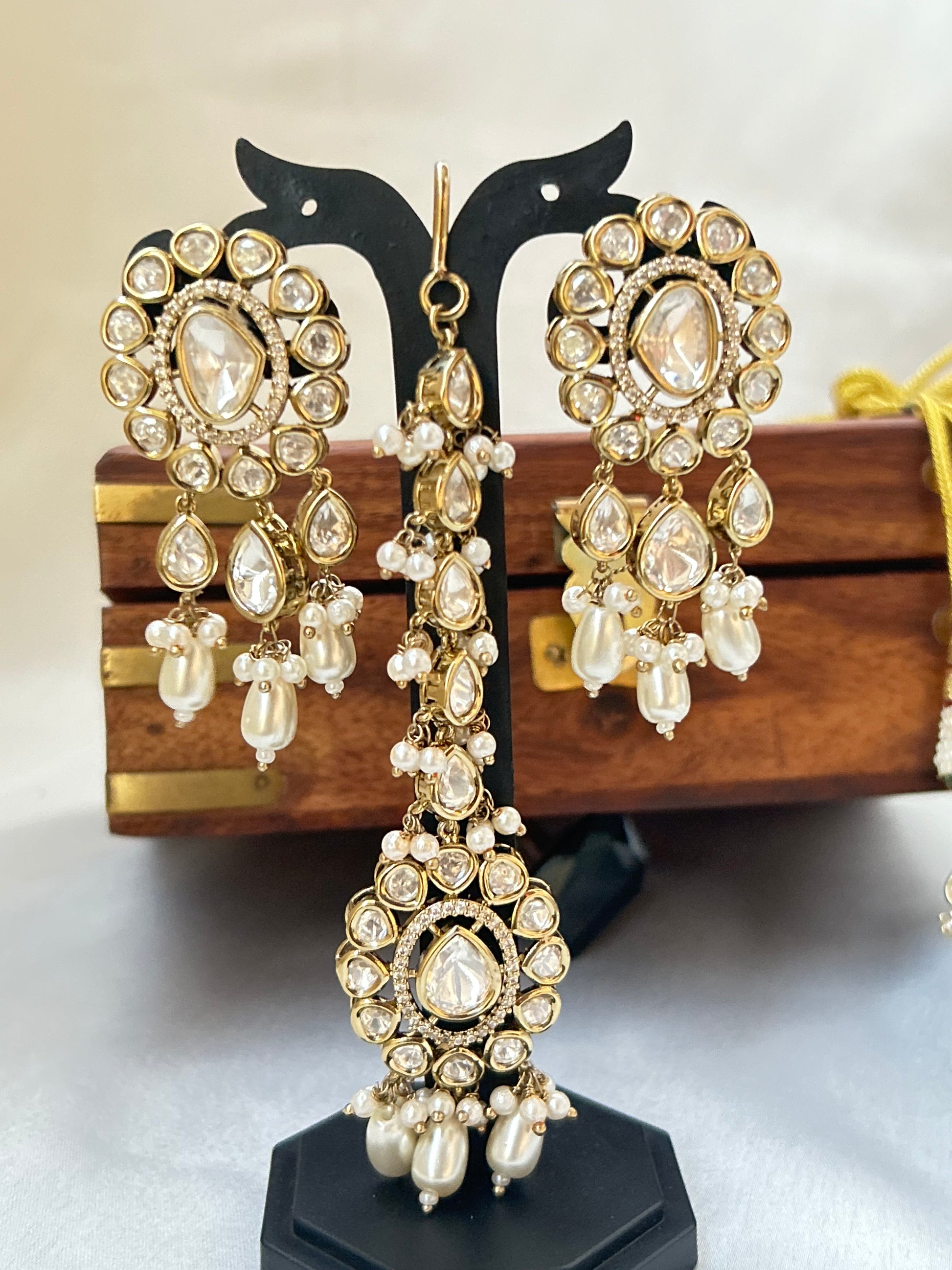 Tashi Kundan Rani Haar (long necklace set with tika )with ivory pearl drops, a regal choice for bridal and festive occasions."