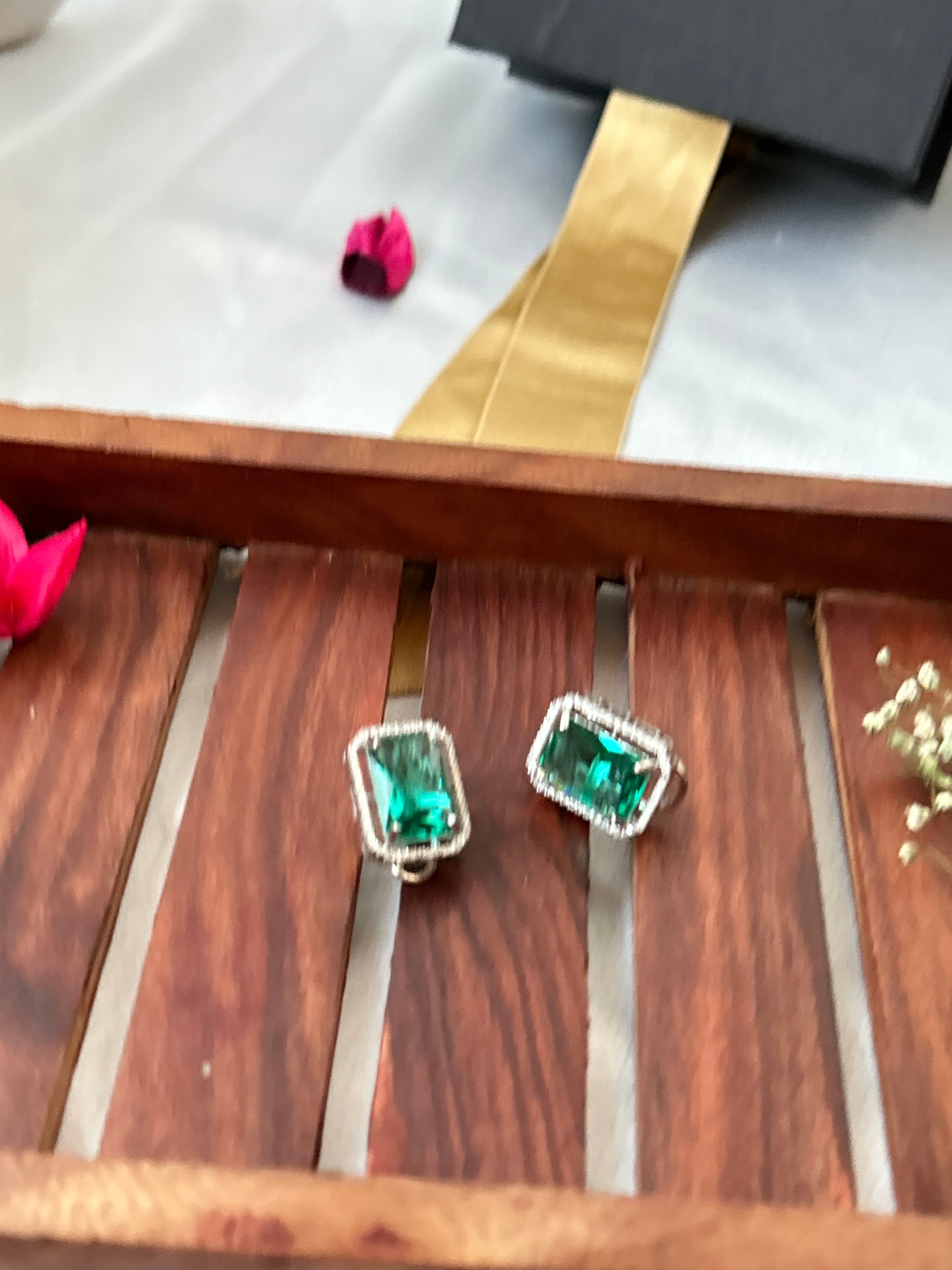 sea green stud earrings with an American diamond halo in a silver-plated setting
