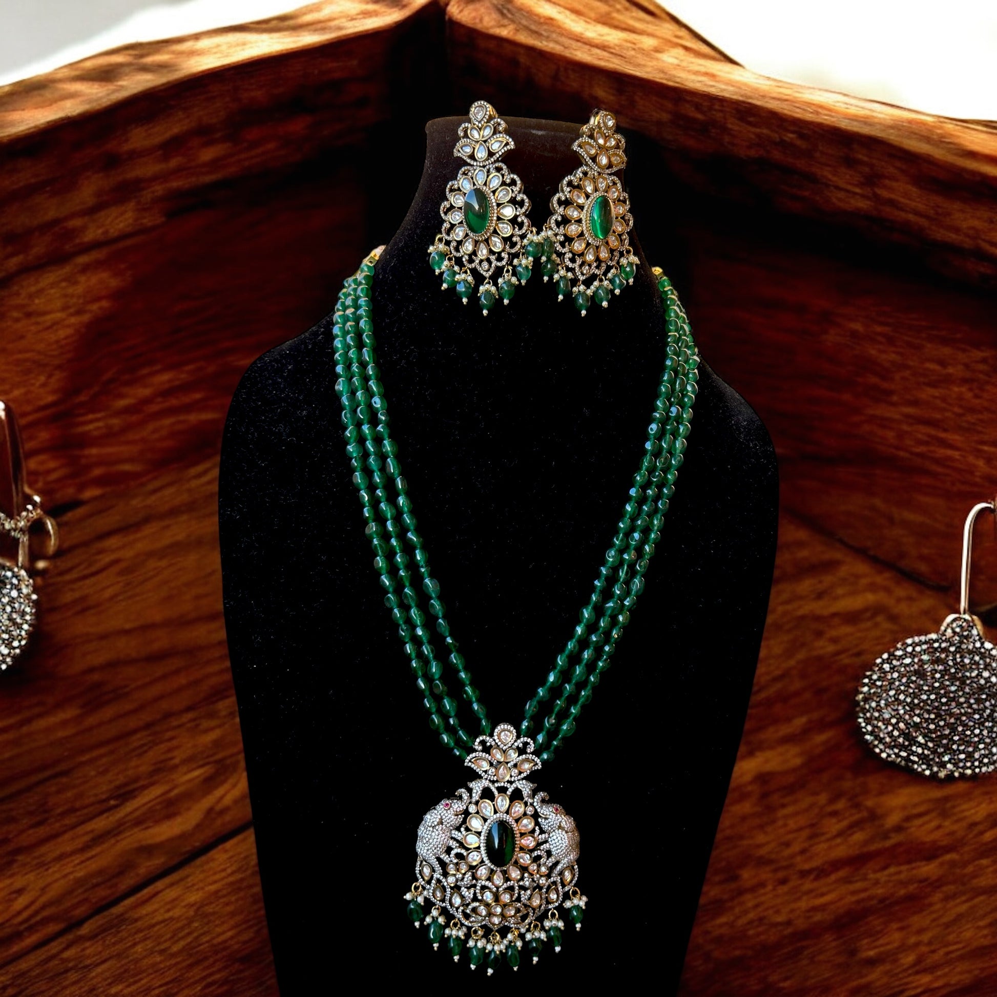 Simar Emerald Kundan Necklace Set with lush green beads, uncut Kundan stones, and matching earrings, perfect for bridal and festive wear.