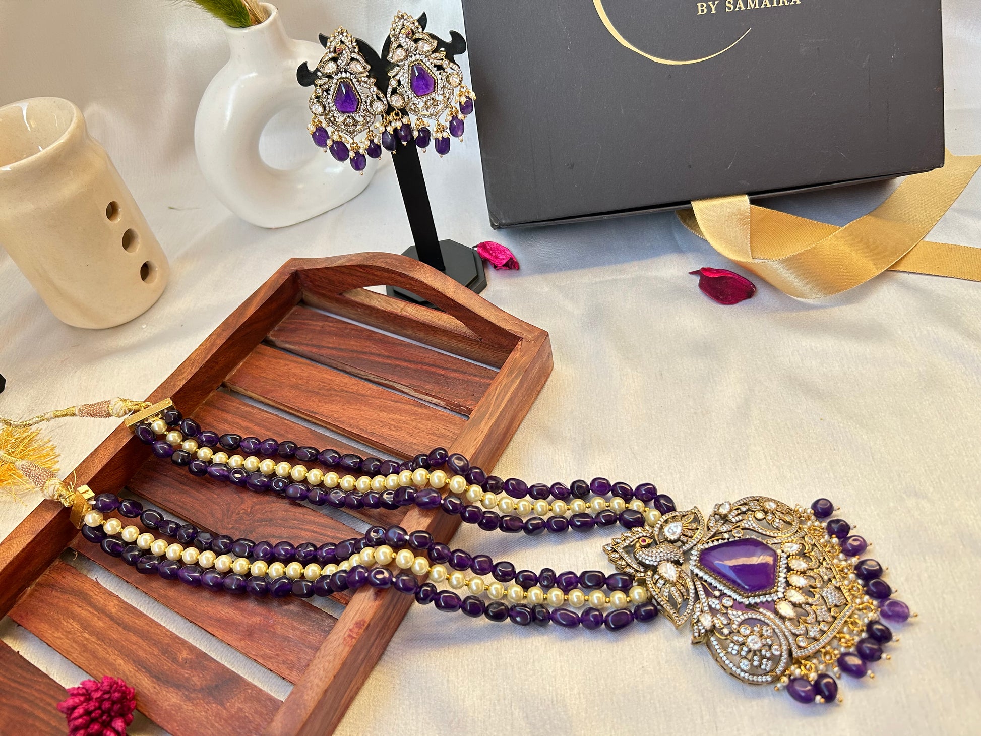Elegant Kiara Kundan Necklace Set with purple and gold beads, featuring intricate stonework and matching earrings.
