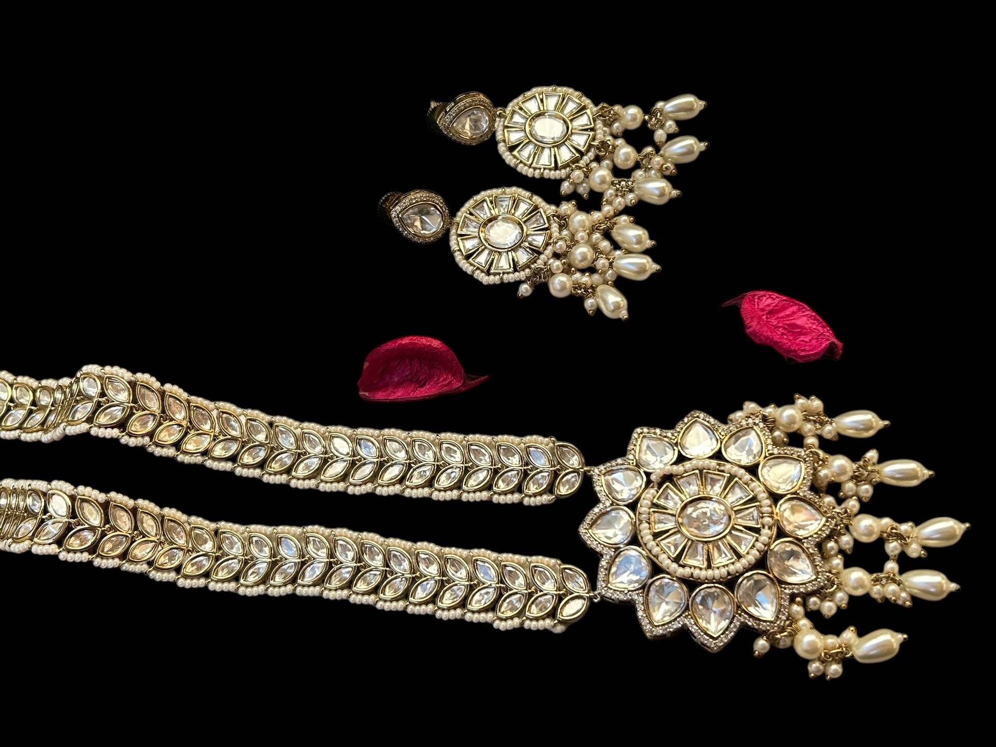 A luxurious Polki Rani Haar set with a statement pendant and matching earrings, perfect for bridal and festive wear.