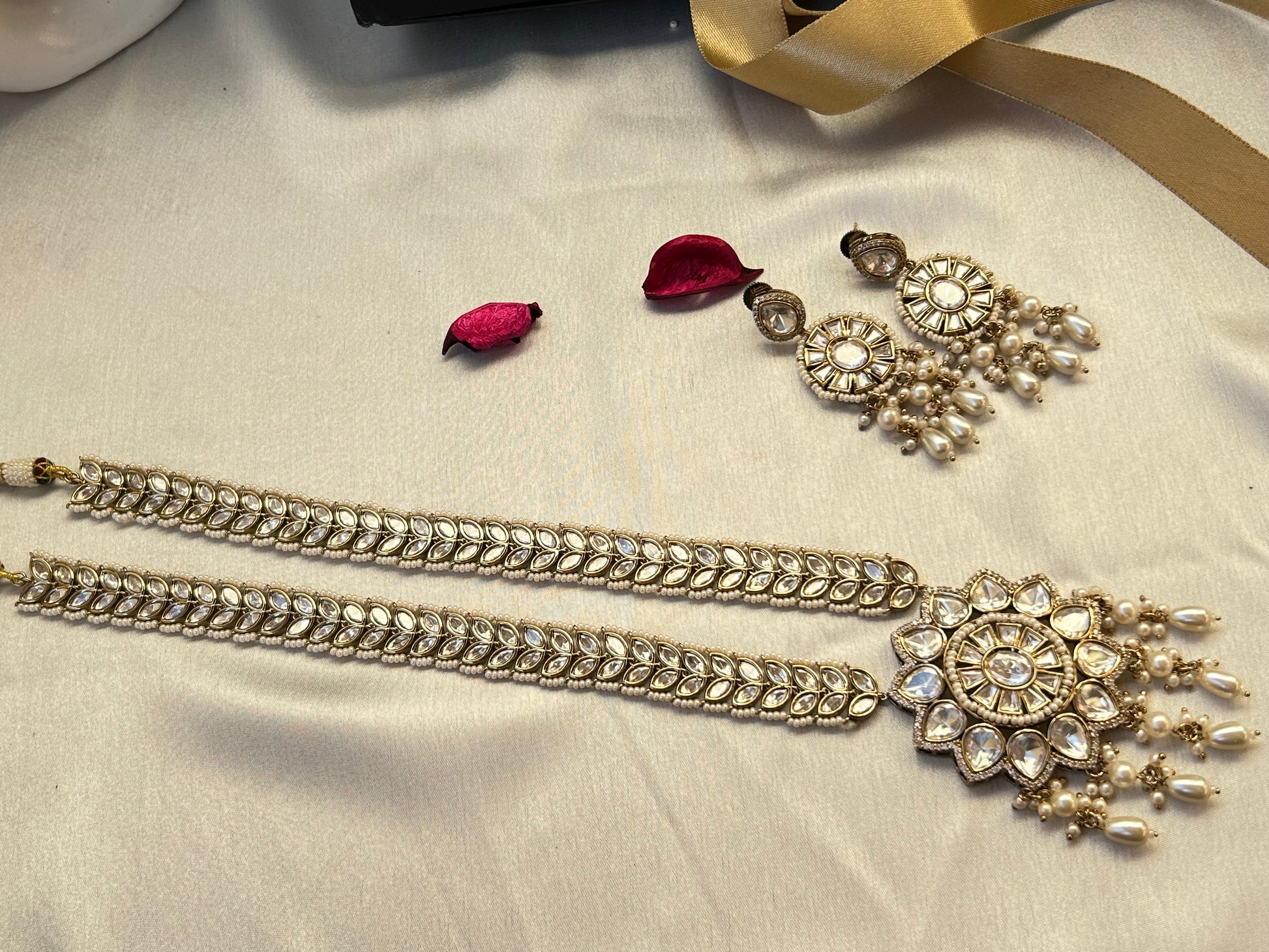 A luxurious Polki Rani Haar set with a statement pendant and matching earrings, perfect for bridal and festive wear.