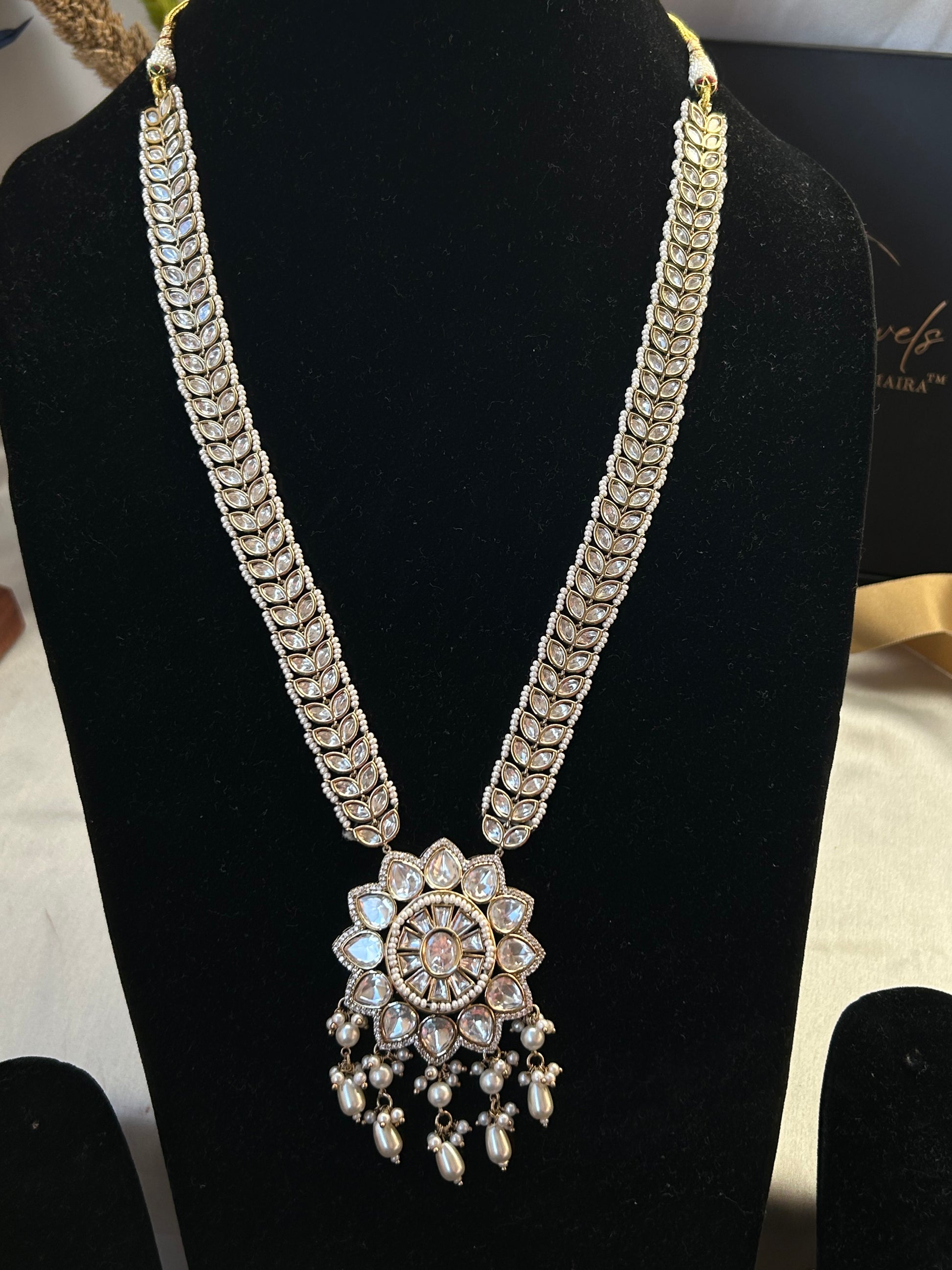 A luxurious Polki Rani Haar set with a statement pendant and matching earrings, perfect for bridal and festive wear.