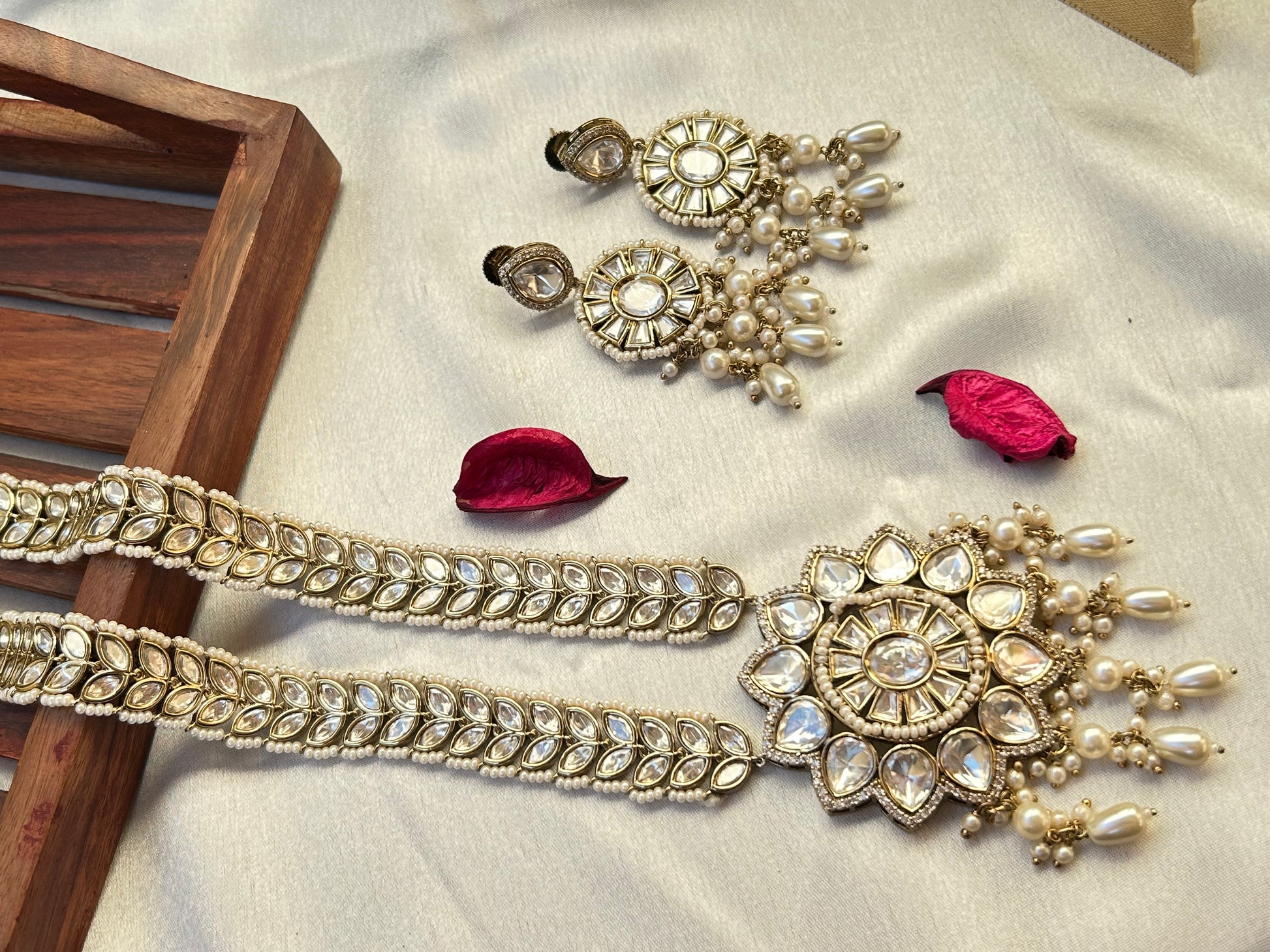 A luxurious Polki Rani Haar set with a statement pendant and matching earrings, perfect for bridal and festive wear.