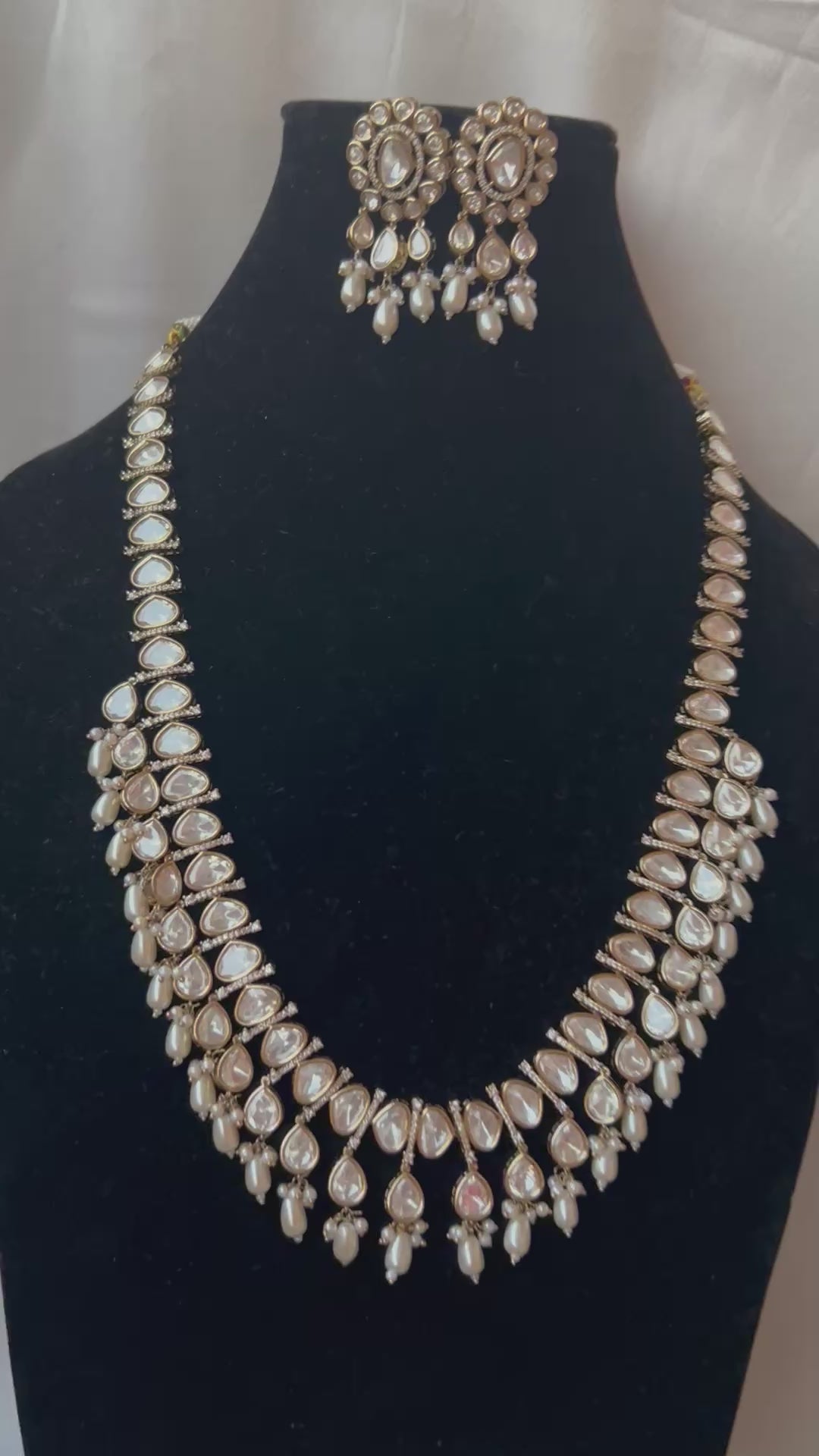Tashi Kundan Rani Haar (long necklace set with tika )with ivory pearl drops, a regal choice for bridal and festive occasions."